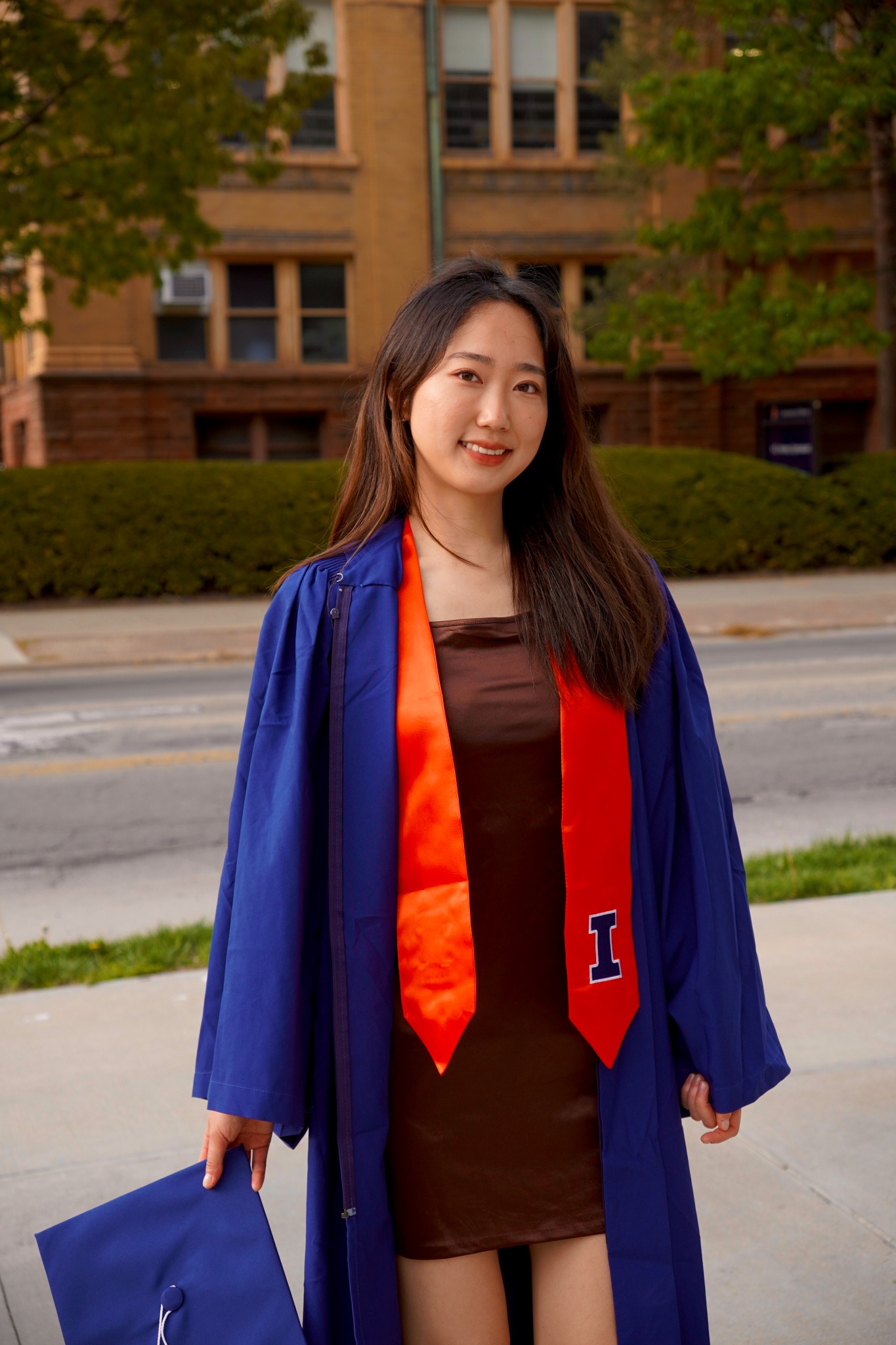 Jiyoo Kim wearing her University of Illinois graduation gown